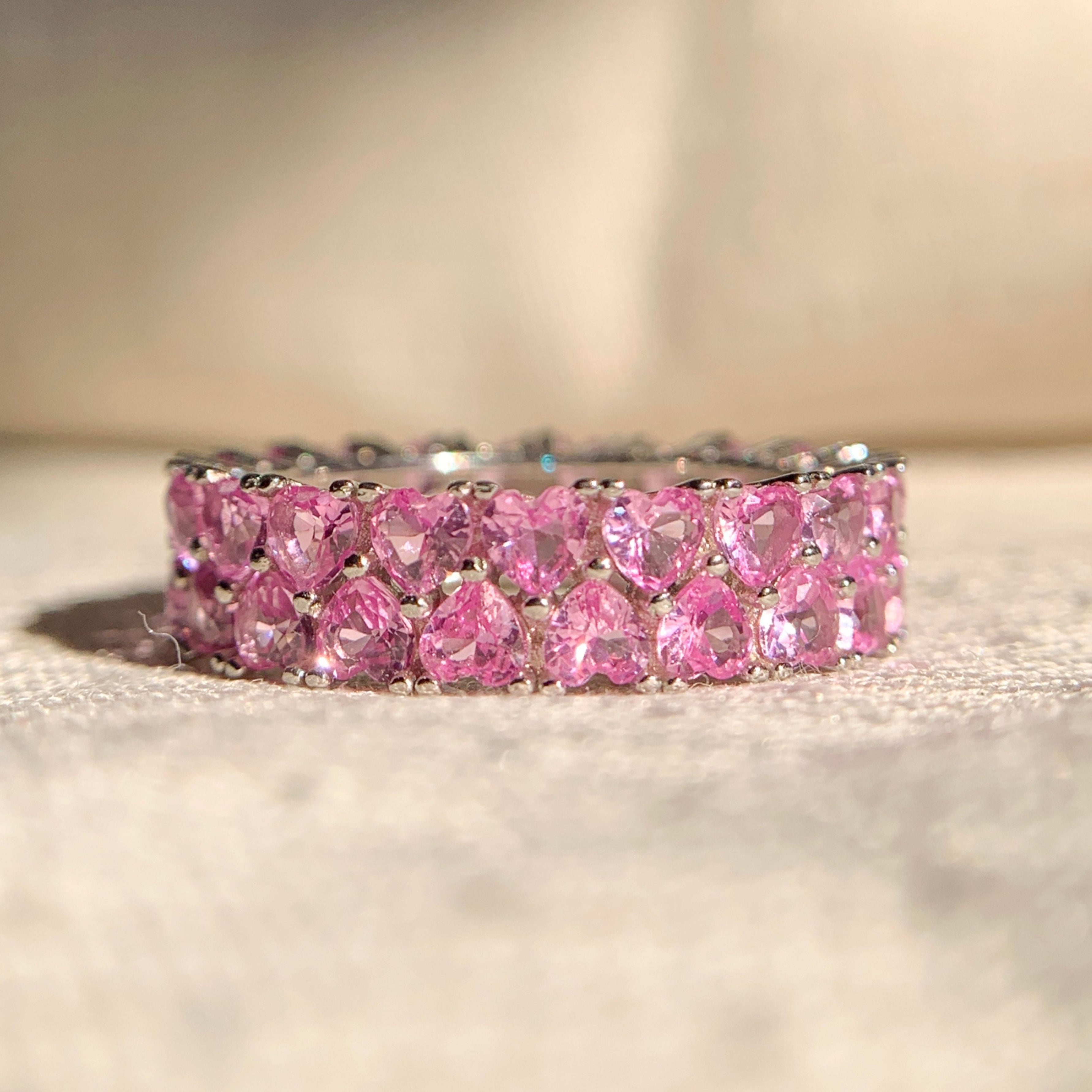 “Pink heart double row diamond band in 14k rose gold for elegant everyday wear”